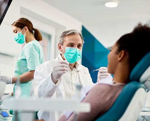 Dentist treats patient